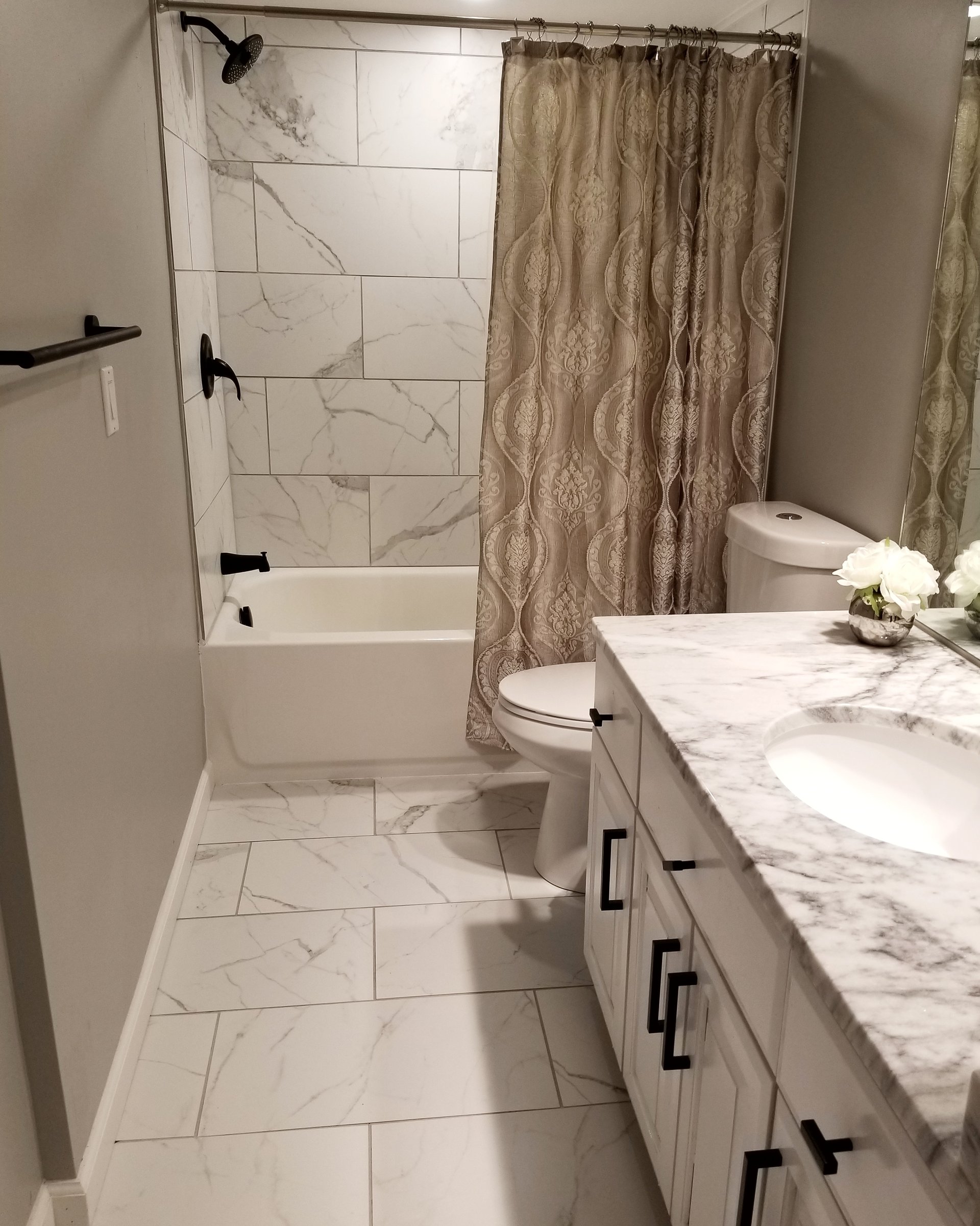 Custom marble vanity & subway tile bath renovation