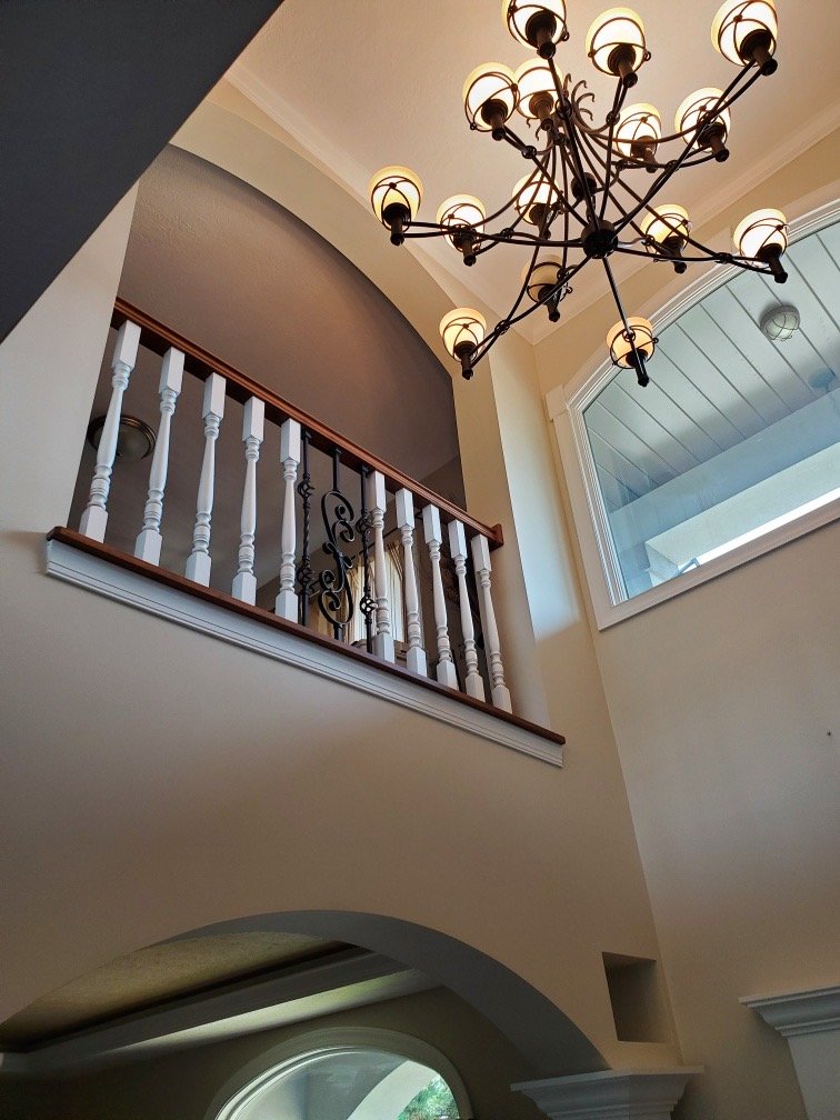 Custom two-story foyer with elegant chandelier & architectural details